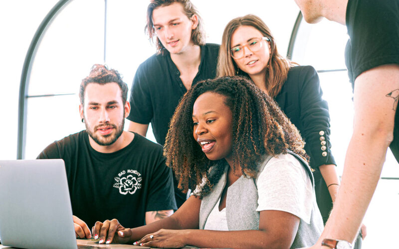 Group of College Students in front of Computer